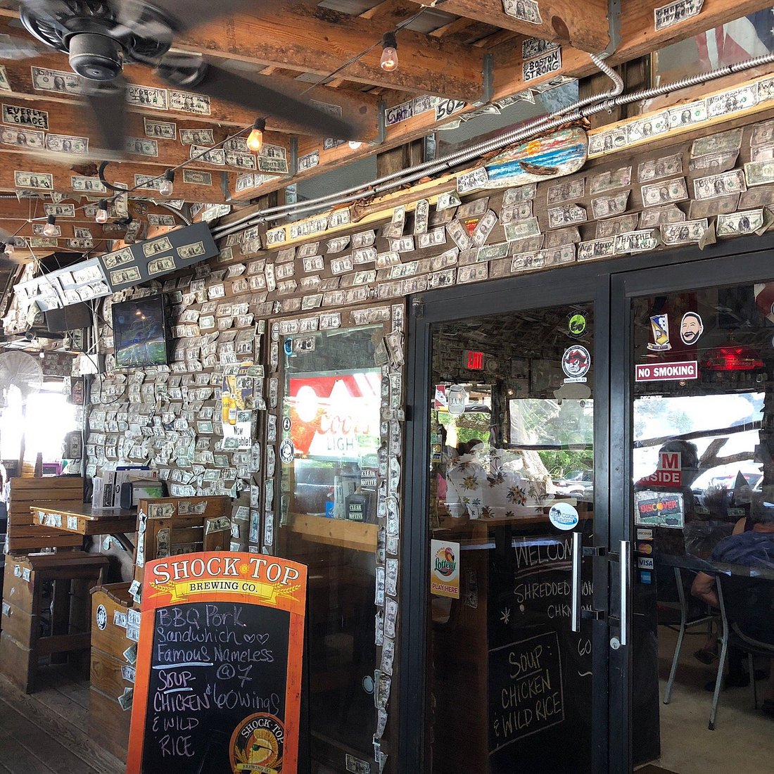 Inside Hub Stacey's, the local dockside bar with dollar bills covering the walls