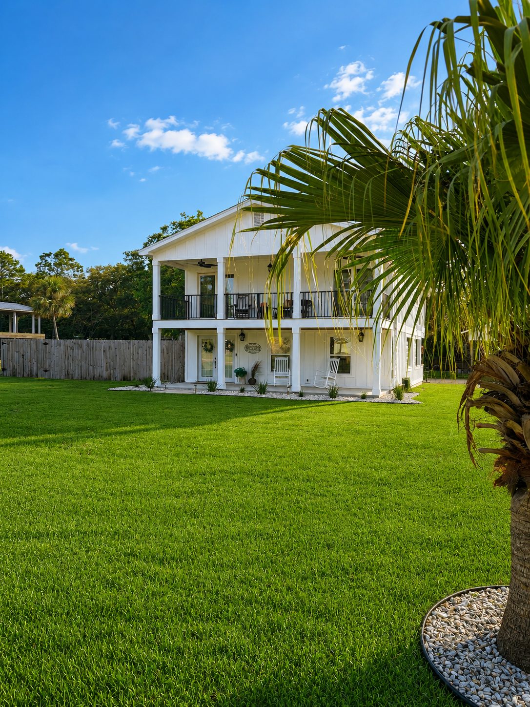 Front exterior of White Lotus vacation rental in Innerarity Point, Florida.